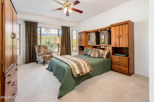 bedroom with light carpet and ceiling fan