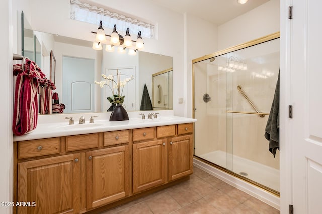 bathroom with an enclosed shower, vanity, and tile patterned floors