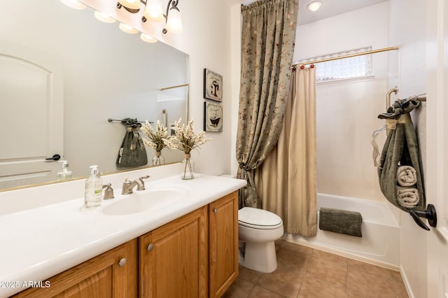 full bathroom featuring vanity, toilet, tile patterned flooring, and shower / tub combo