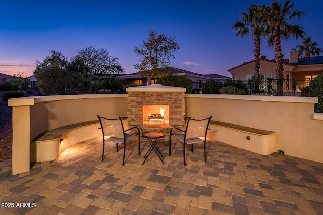 view of patio terrace at dusk