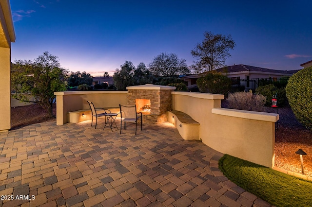 view of patio terrace at dusk