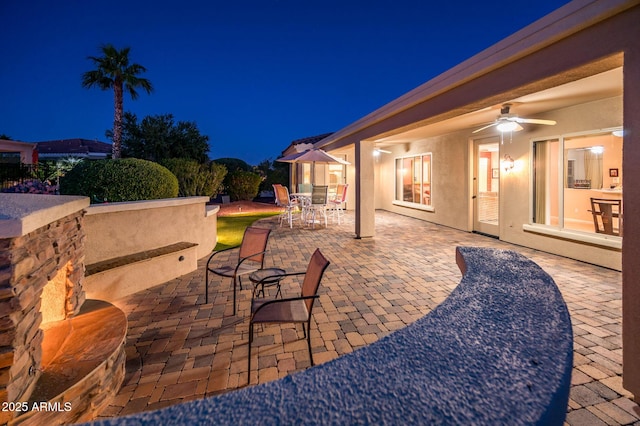 patio at twilight with ceiling fan