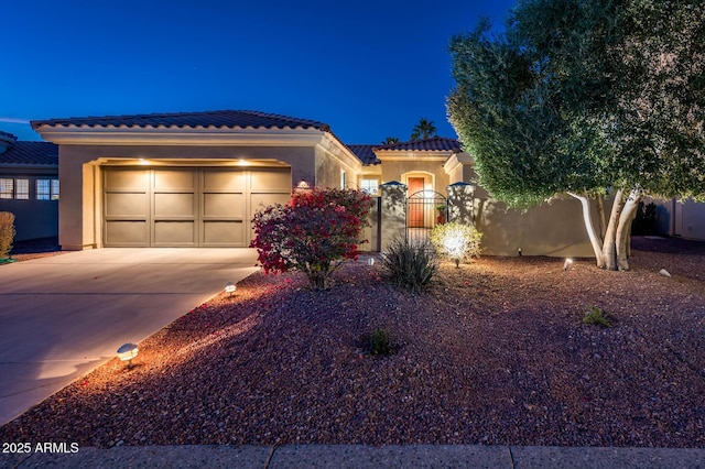 mediterranean / spanish-style home featuring a garage