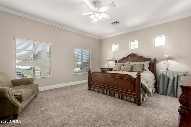 bedroom featuring visible vents, baseboards, crown molding, and light colored carpet