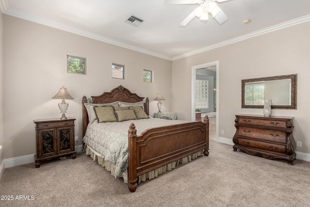 bedroom featuring light colored carpet, visible vents, ornamental molding, ensuite bath, and baseboards