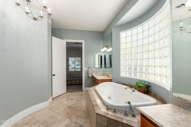 bathroom featuring baseboards, ensuite bathroom, an inviting chandelier, vanity, and a bath