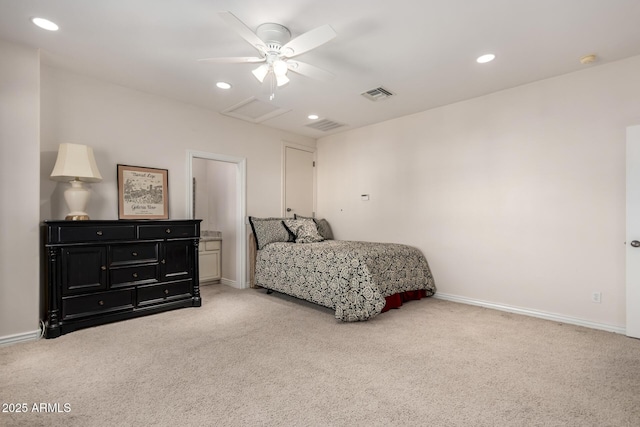 bedroom with light carpet, attic access, visible vents, and baseboards