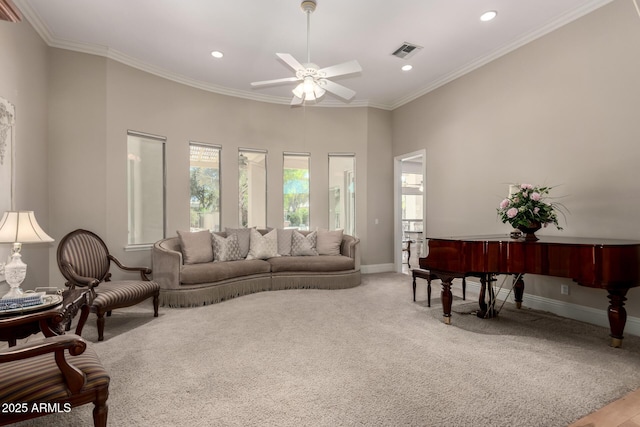 living room with carpet floors, baseboards, visible vents, and crown molding