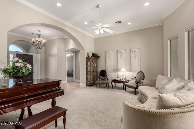 living area featuring ornamental molding, arched walkways, light carpet, and visible vents