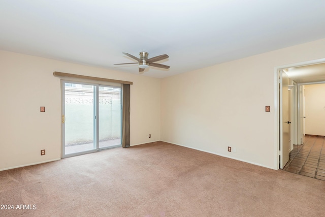 unfurnished room with ceiling fan and light carpet