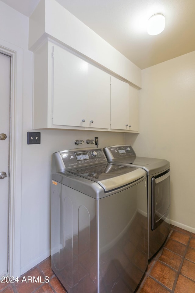 laundry area with cabinets and separate washer and dryer