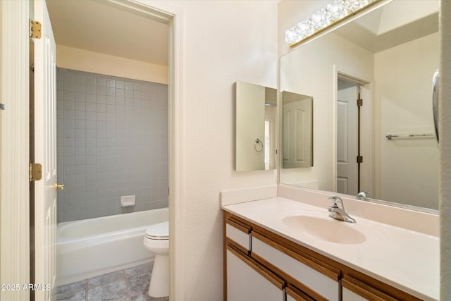 bathroom with toilet, shower / bathing tub combination, and vanity