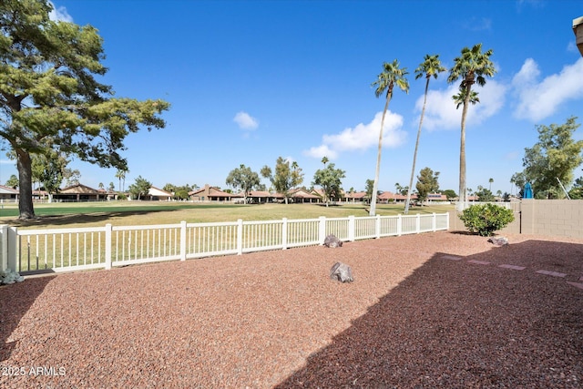 view of yard with a residential view and a fenced backyard