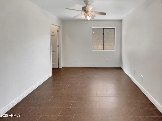 unfurnished room with ceiling fan