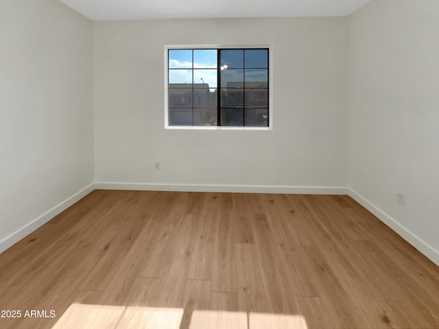 unfurnished room featuring light wood-type flooring