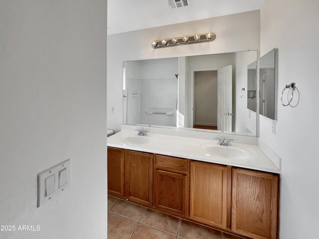 bathroom featuring tile patterned floors and vanity