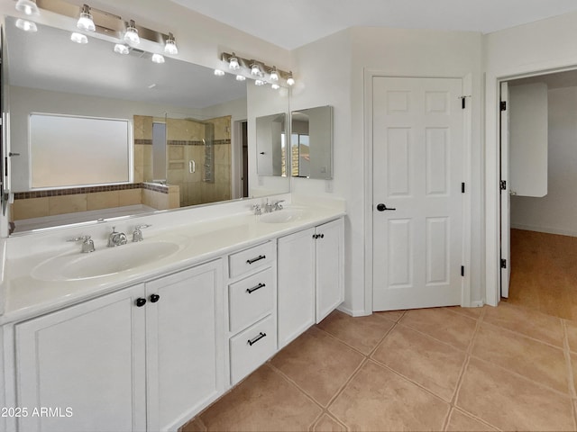 bathroom featuring tile patterned flooring, vanity, and a shower with shower door