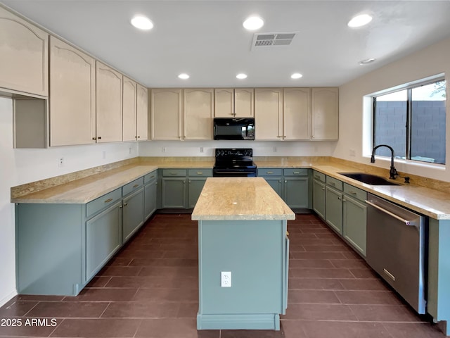 kitchen with sink, a kitchen island, and black appliances