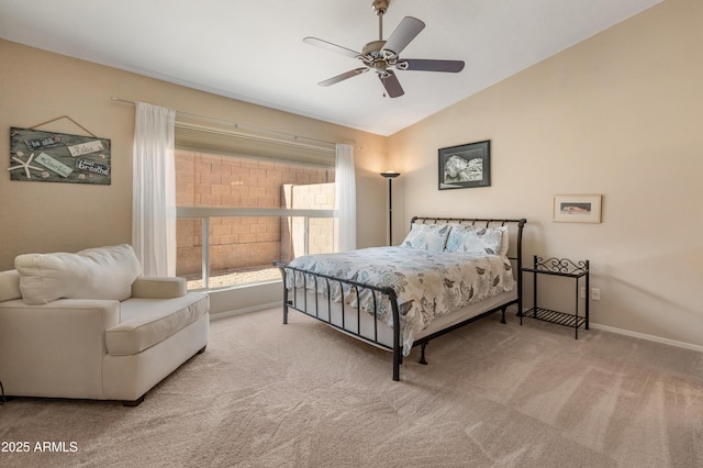 bedroom featuring lofted ceiling, carpet flooring, baseboards, and ceiling fan