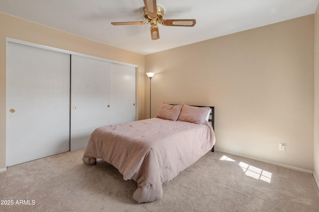 bedroom featuring carpet flooring, a closet, and ceiling fan