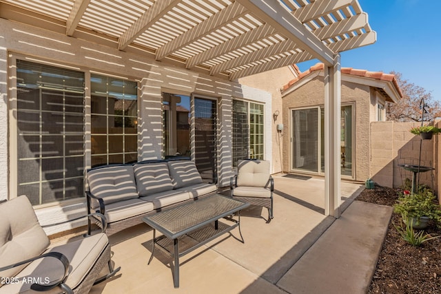 view of patio with an outdoor living space, fence, and a pergola