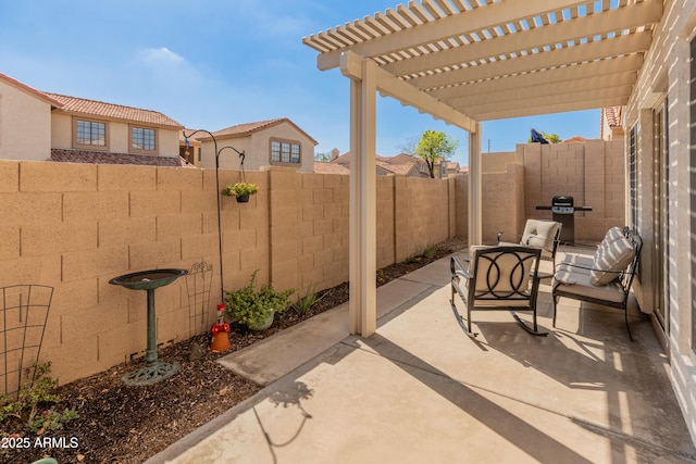 view of patio / terrace with a fenced backyard and a pergola