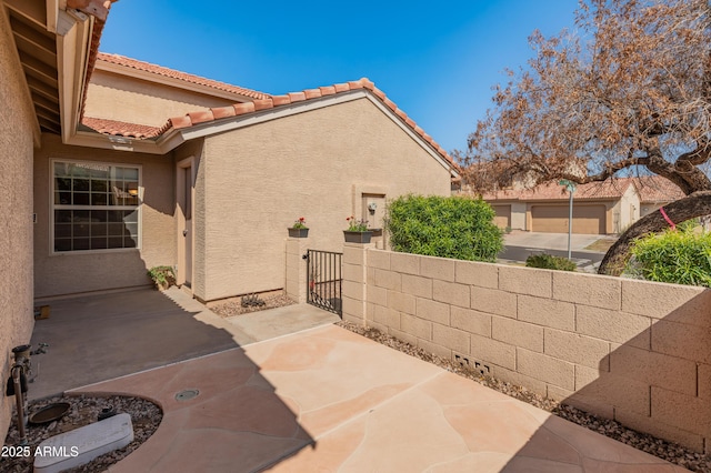 view of patio / terrace with a gate and fence