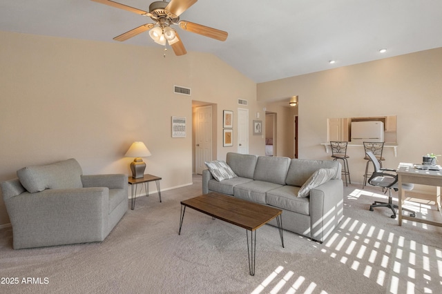 living room with visible vents, light colored carpet, high vaulted ceiling, and ceiling fan