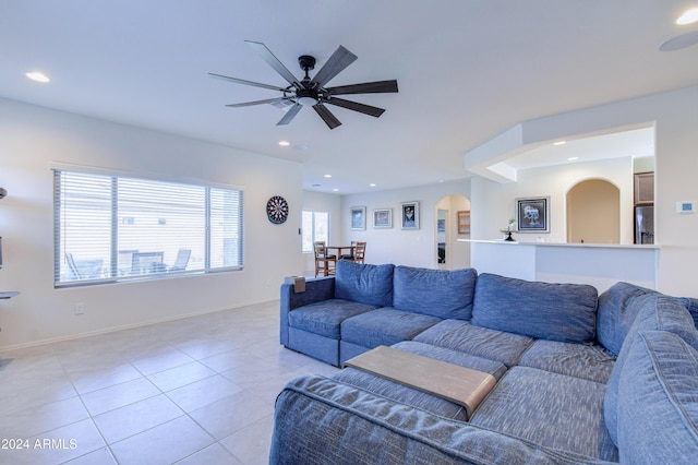 tiled living room featuring ceiling fan