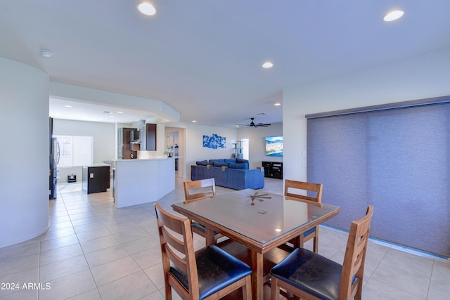 dining area with ceiling fan and light tile patterned floors