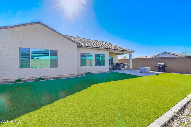 rear view of house with a patio