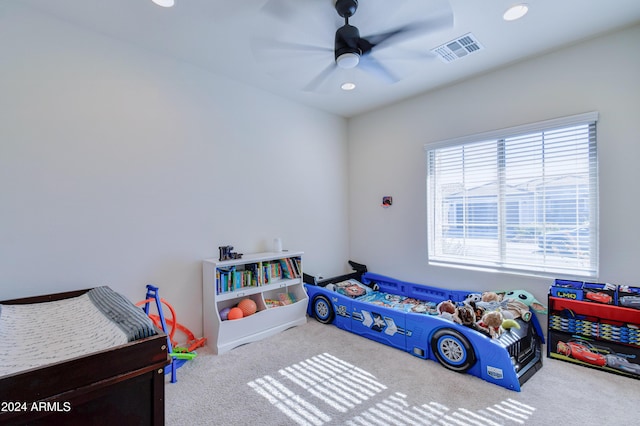 bedroom featuring ceiling fan and light colored carpet