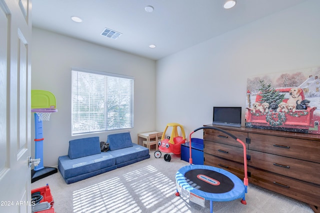 game room with light carpet