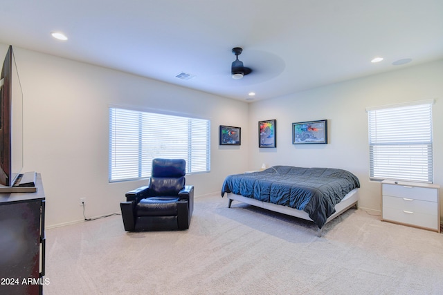 bedroom with ceiling fan and light colored carpet