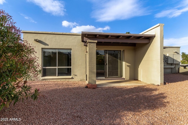 rear view of house featuring a patio