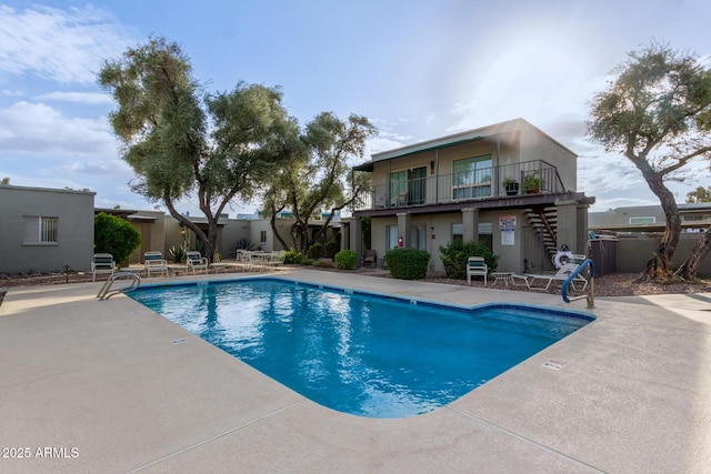 view of swimming pool with a patio