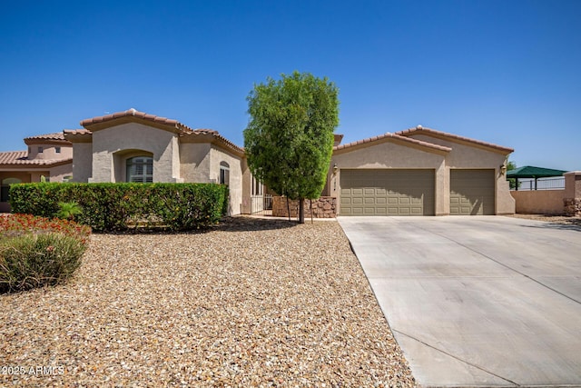 1804 W Magdalena Ln, Phoenix, AZ 85041 - mediterranean / spanish house with stucco siding, an attached garage, driveway, a tiled roof, and fence