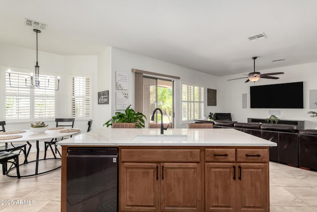 1804 W Magdalena Ln, Phoenix, AZ 85041 - kitchen with a sink, dishwashing machine, a chandelier, light stone countertops, and pendant lighting