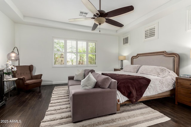 1804 W Magdalena Ln, Phoenix, AZ 85041 - bedroom with wood finished floors, a tray ceiling, baseboards, and a ceiling fan