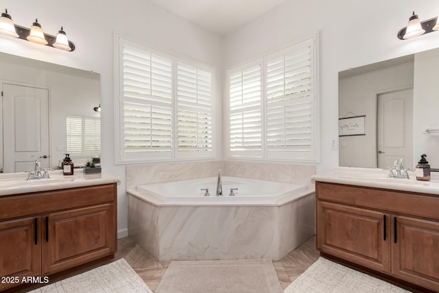 1804 W Magdalena Ln, Phoenix, AZ 85041 - bathroom featuring two vanities, plenty of natural light, and a bath