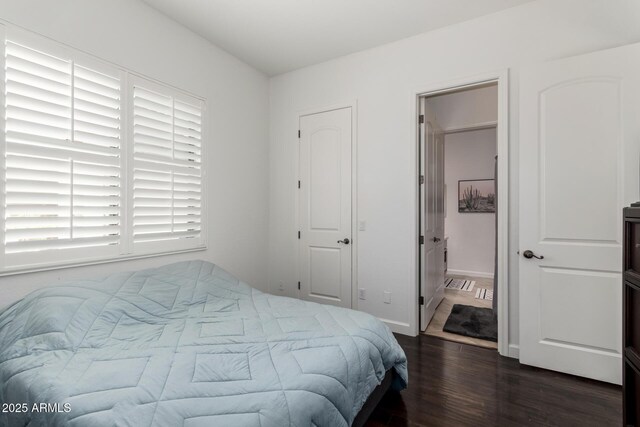 1804 W Magdalena Ln, Phoenix, AZ 85041 - bedroom with wood finished floors and connected bathroom