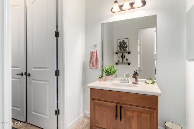 1804 W Magdalena Ln, Phoenix, AZ 85041 - bathroom with vanity and baseboards