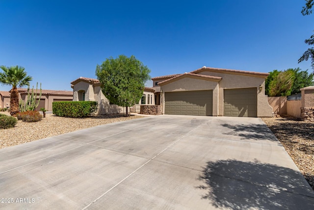 1804 W Magdalena Ln, Phoenix, AZ 85041 - view of front of home with stucco siding, a garage, concrete driveway, a tile roof, and fence