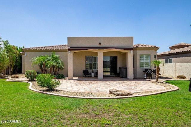 1804 W Magdalena Ln, Phoenix, AZ 85041 - rear view of house featuring a patio, a lawn, and stucco siding
