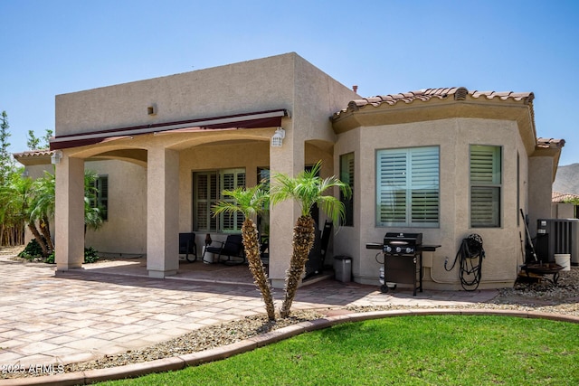 1804 W Magdalena Ln, Phoenix, AZ 85041 - rear view of property with a patio, stucco siding, and central air condition unit