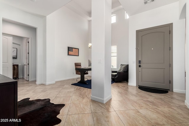 1804 W Magdalena Ln, Phoenix, AZ 85041 - entrance foyer featuring plenty of natural light, baseboards, and a towering ceiling