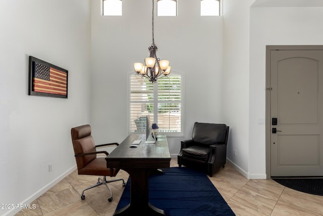 1804 W Magdalena Ln, Phoenix, AZ 85041 - home office with a towering ceiling, healthy amount of natural light, a chandelier, and baseboards