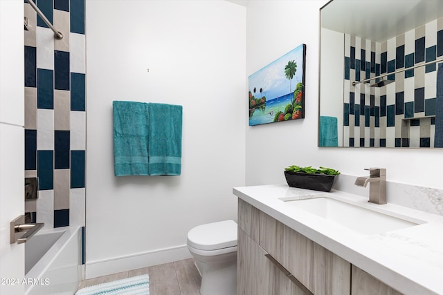 full bathroom with washtub / shower combination, vanity, and toilet