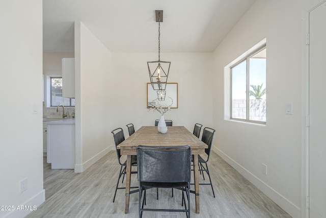 6731 W Northview Ave, Glendale, AZ 85303 - dining space with light wood-style floors and baseboards