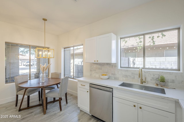 6731 W Northview Ave, Glendale, AZ 85303 - kitchen with a chandelier, a healthy amount of sunlight, stainless steel dishwasher, and a sink